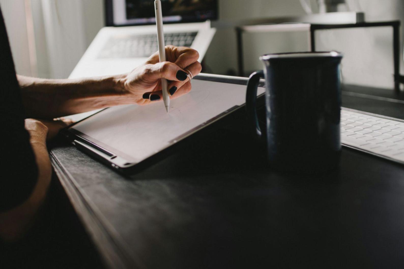 Financial planning session with charts and documentation spread across a conference table