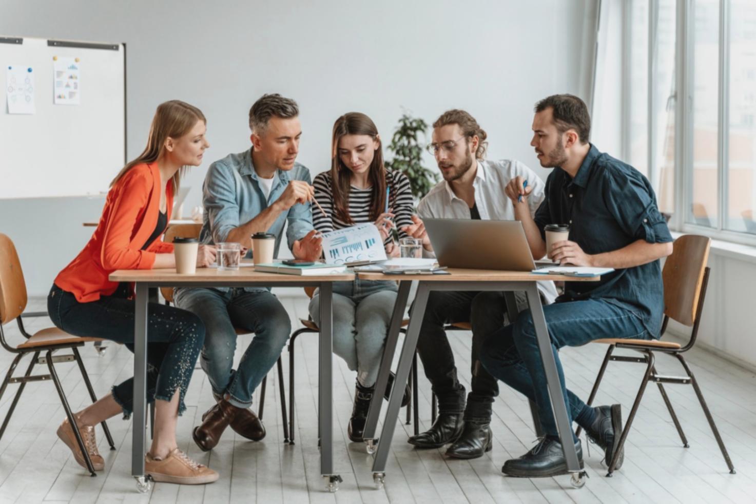 Financial planning workspace showing strategic documents and analysis tools used in income optimization consultations